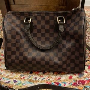Brown checkered canvas handbag with adjustable strap